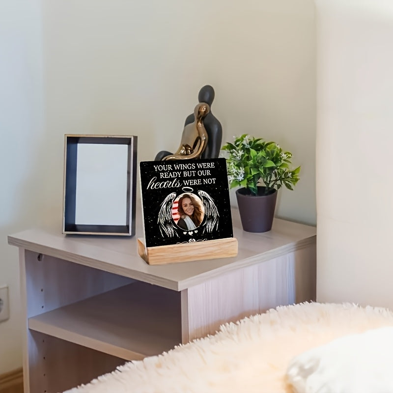 Personalized acrylic photo frame on a nightstand displaying a cherished memory and decorative plant.