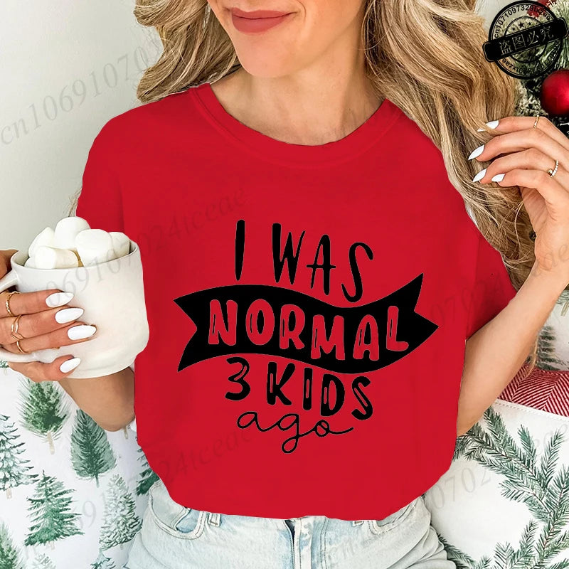 Funny mom t-shirt with humorous quote 'I was normal 3 kids ago' in bold text on a red graphic tee.