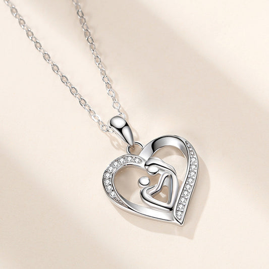 Silver heart mother child pendant on a chain, symbolizing love and connection in personalized jewelry.
