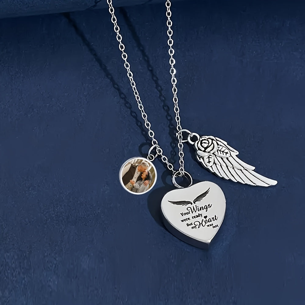 Customizable memorial pendant necklace featuring a heart charm and angel wings with a photo insert.
