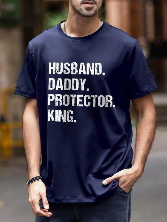 Men's summer slogan t-shirt featuring the words Husband. Daddy. Protector. King. on a navy background.