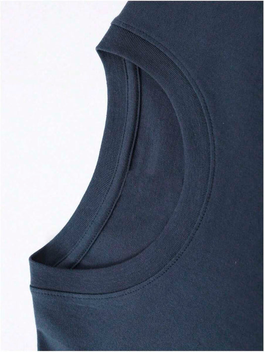 Close-up of armhole detailing on vintage 250th anniversary t-shirt in dark fabric.