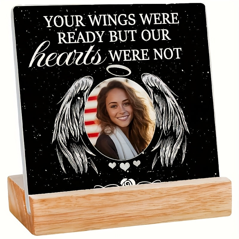 Personalized acrylic photo frame featuring wings design and a custom picture, perfect for memorial decor.